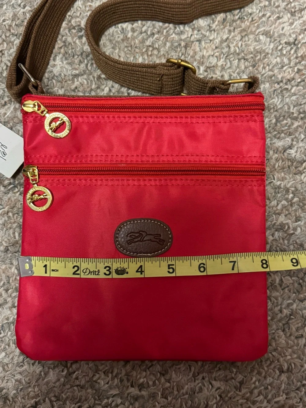 Longchamp Red Crossbody Bag with Brown Strap and Gold Accents